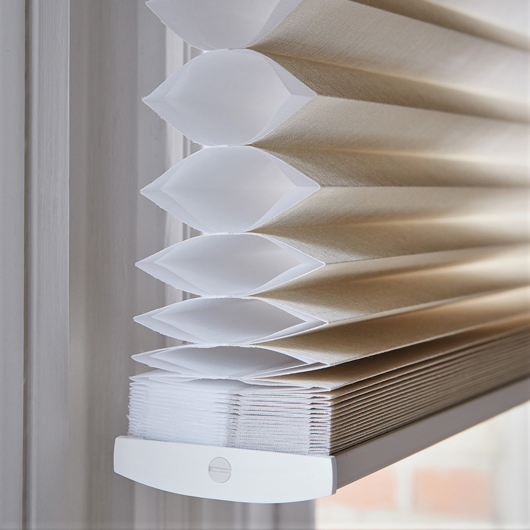 A close up of unique cellular design of Duettes Architella honeycomb shade